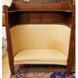 An Arts & Crafts oak panelled back fireside settle, circa 1905, in the manner of Liberty,