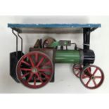 An early 20th Century model of a steam roller, made by Mamod. In need of restoration.