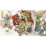 A collection of vintage costume jewellery to include paste set brooches, gilt metal and white