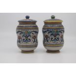 A pair of small Deruta maiolica albarello and covers, circa 1930, of typically waisted form and