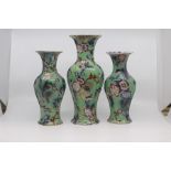A garniture of English earthenware vases, circa 1850, of lobed ovoid form and decorated with