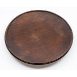 A 19th Century mahogany lazy susan, the moulded circular top above a moulded base, 35cm dia.