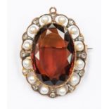 A cairngorm coloured citrine, pearl and diamond set brooch, the oval citrine set to the centre
