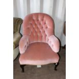 Two upholstered chairs, comprising a late 19th / early 20th Century upholstered armchair with