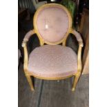 A 19th Century French giltwood open armchair, in the Neo-Classical style, fitted with an oval back