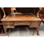 A mid 20th Century reproduction ladies desk with brown leather inserted writing top along with