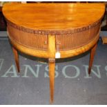 A George III mahogany demilune table, fitted with two sliding tambour doors, raised on square