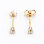 A pair of 18ct gold diamond solitaire stud earrings, each stone of approx 0.15ct, claw set, total