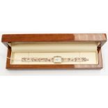 A silver cased 'Footprints' ladies watch, rectangular white enamel dial, case approx. 18 x 23mm,