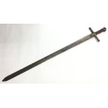 Sudanese Kaskara sword with fullered double edged blade 88cm in length,  Overall length 101.5cm
