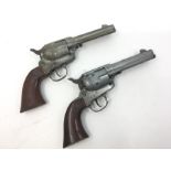 Pair of Daisy .177 BB guns in the form of a revolver. All black painted finish has been removed.