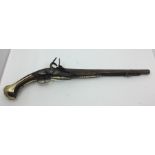 Flintlock Pistol with 350mm long barrel. No ramrod. Brass mounts. 525mm overall length. Stock,