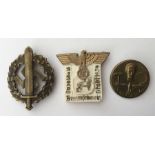 WW2 Third Reich Mai 1st 1934 tinnie, maker marked and a Kreistag Braunschweig Stadt 1939 tinnie