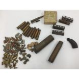 A collection of spent brass cartridge cases including WW1 dated .303, 20mm case dated 1953, 30mm
