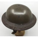 WW2 British MKII Steel helmet with smooth green paint finish. Size 7 liner by Vero dated 1938.