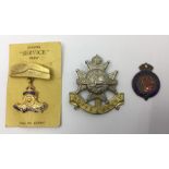 WW2 British Royal Artillery sweetheart brooch on original card, RMS Mauretania enamel fob, and a