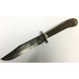 British Bowie knife with unmarked 205mm long blade. Overall length 360mm. Checkered wooden grips.