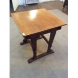 An early 20th Century oak trestle type table