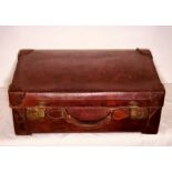 A 1930's brown leather suitcase, brass mounted locks engraved with "Secure Lever" on, leather