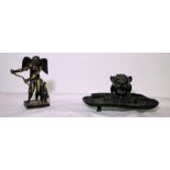 A 19th century pewter inkstand; A brass figurine paperweight. (2)
