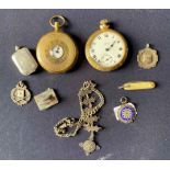 Assorted items to include two pocket watches, pen knife, fob chain, three fobs and a plated stamp
