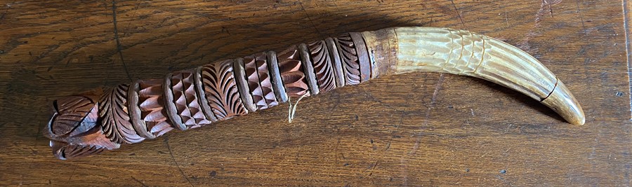 A cased pair of early 20th century bone opera glasses and a carved wooden and horn tribal tusk (2)