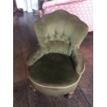 Nursing chair, fitted with green upholstery, braided edge