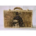 A 19th Century aboriginal form crocodile suitcase, crocodiles scale back on the lid with leather
