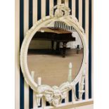 A 20th century painted oak two branch girandole mirror, surmount of oak and olive leaves and with