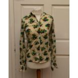 An early 1970’s cotton Jersey blouse with a predominately green, purple and yellow rainbows and tree