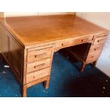 An early 20th century oak pedestal desk, fitted with an arrangement two pull out slides, one long