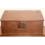 A 17th Century oak bible box, the sloped front enclosing a two drawer interior, fitted with period