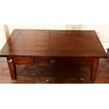 A 20th century solid oak low living room table, rectangular top above a single fitted table,