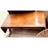 A 20th century mahogany low sofa table, in a Georgian manner, fitted with two drawers, raised on