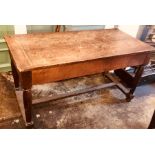 An 18th century oak farmhouse refectory table, plank top fitted with a single drawer, raised on