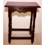 A George III oak joined stool, circa 1770, rectangular top on baluster supports united with square