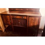 An Edwardian mahogany crossbanded inverted breakfront sideboard by James Shoolbred & co, London (