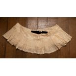 A large part of the hemline off a Victorian wedding dress intricate pleats, fine ribbed work and