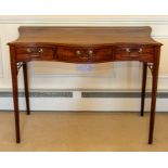 A George III mahogany and inlaid serpentine writing table,