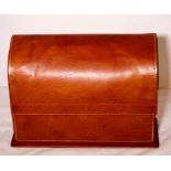 An Asprey of London leather dome shaper letter holder, a leather lid enclosing pigeonholes, Asprey