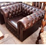 A 20th century chesterfield armchair; another chesterfield stool (2)