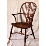An early 19th Century elm and yew wood wheelback Windsor chair, circa 1800, hooped yew wood back