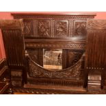 A George III oak fire surround of large proportions,