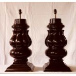 A pair of recreated early 20th century mahogany lamps, recreation from snooker table legs.