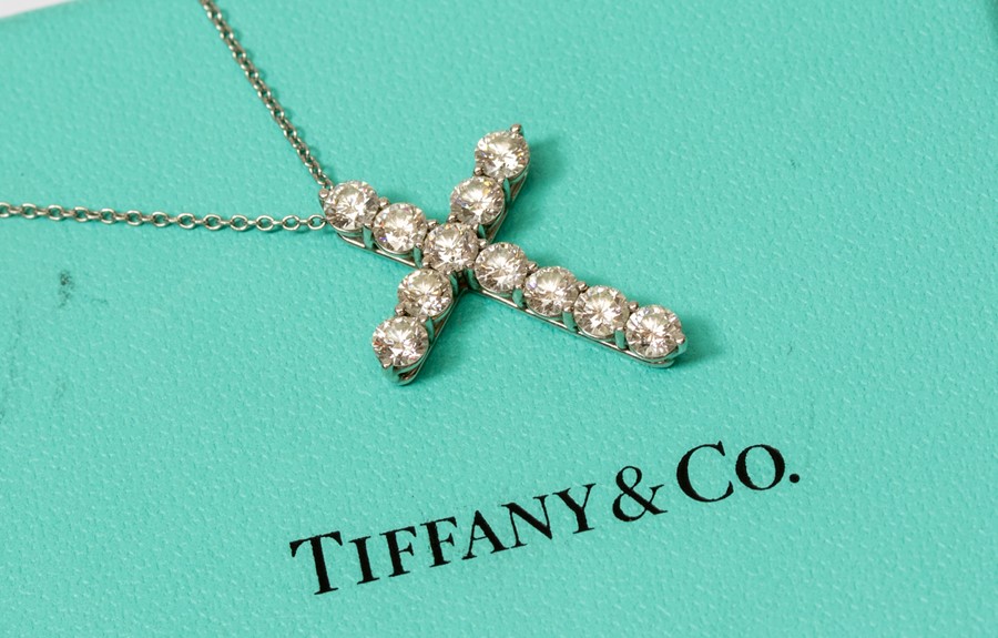 Tiffany & Co - a diamond set Tiffany & Co platinum cross pendant, with eleven round brilliant cut