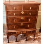 A William & Mary oak chest on stand, circa 1700, moulded cornice above two short and three long