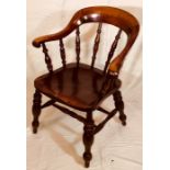 An early Victorian elm and beech smokers bow chair, circa 1850,  beech scrolled shape back and