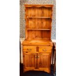 A 20th Century pine dresser, fitted with three tier plate rack on a rectangular dresser with two