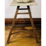 A 20th Century plant stand, square oak top on a cast iron frame. 73cm H