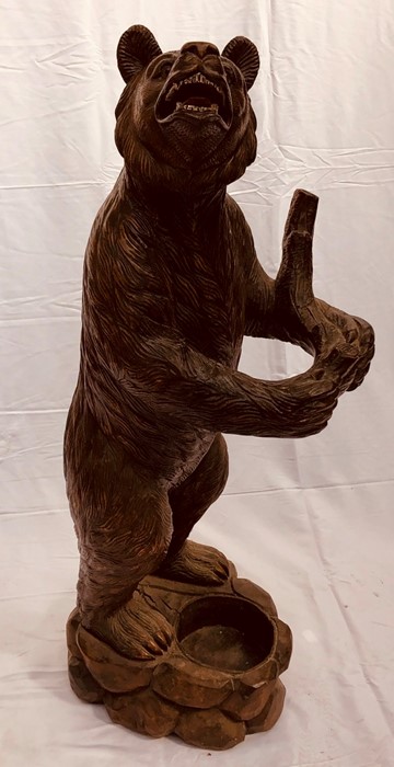 A Black Forest carved wooden Bear stick/umbrella stand, in form of a standing Bear holding a